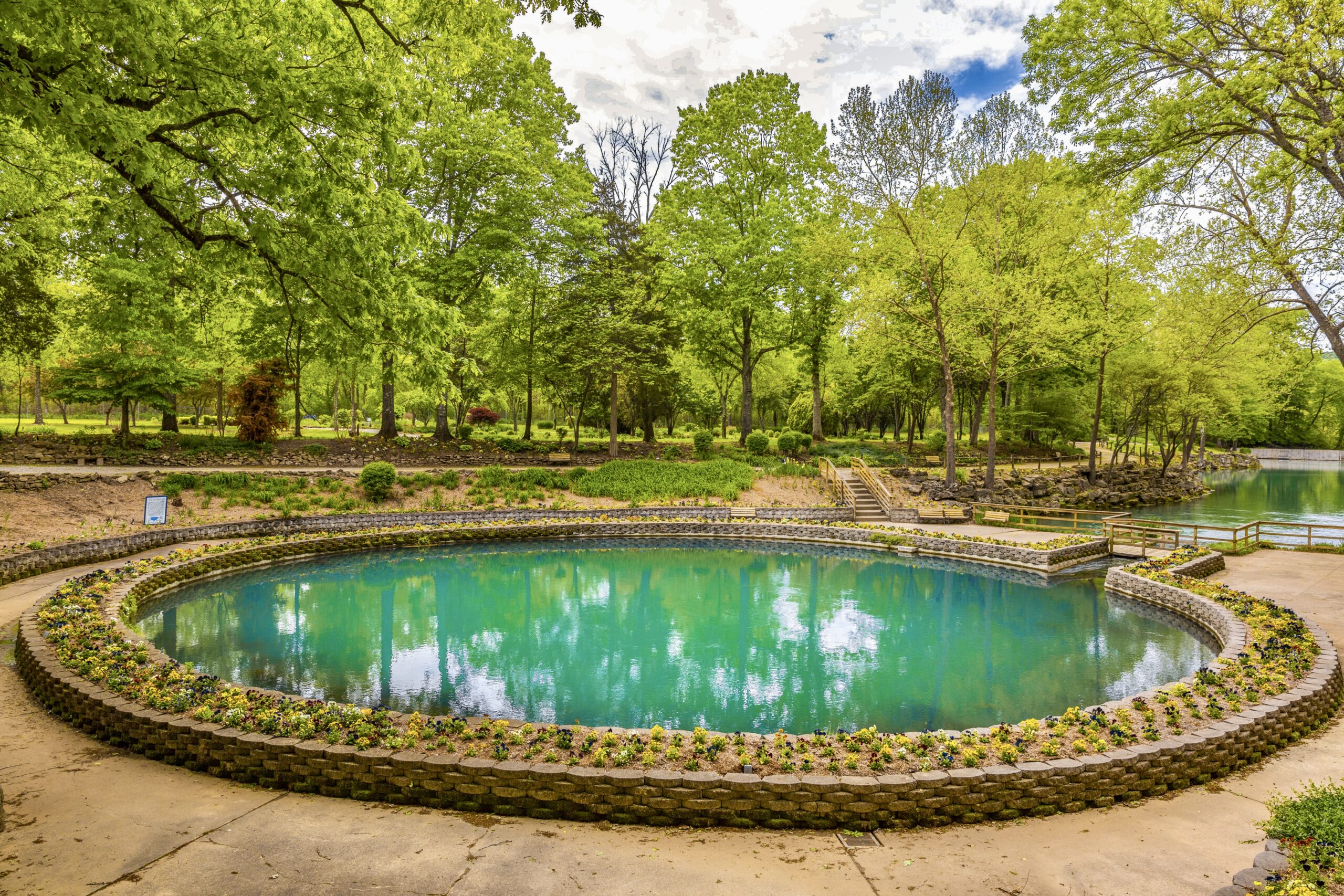 A blue crystal spring during a sunny day, a top thing to do in Eureka Springs.