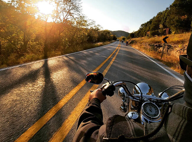 Motorcycling 2 behind the shoulder view of man riding motorcycle