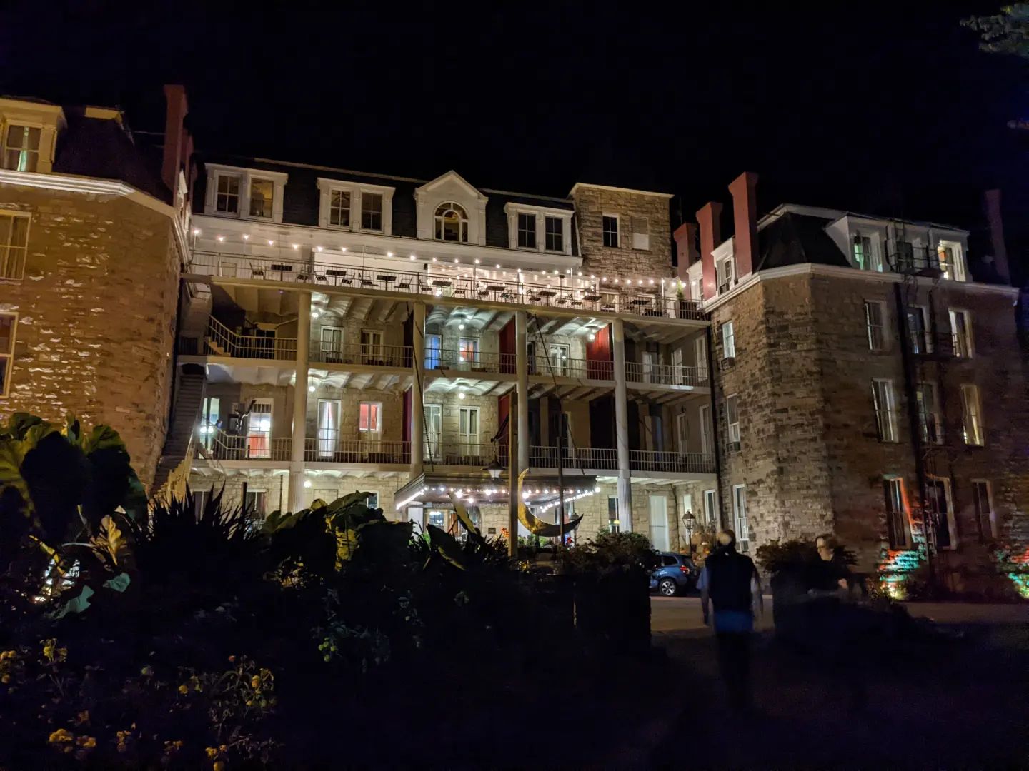 The Crescent Hotel, one of the most haunted places in Eureka Springs and America, outside at dark.